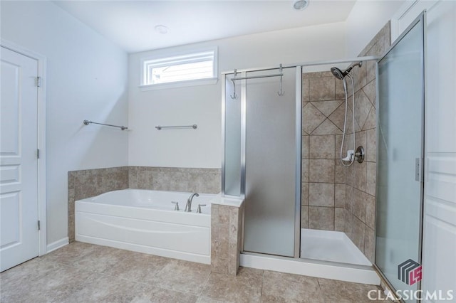 bathroom with separate shower and tub