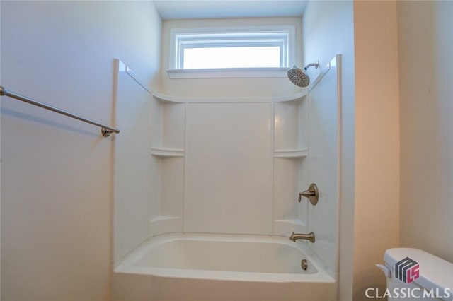 bathroom featuring toilet and shower / washtub combination