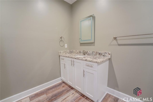 bathroom featuring wood-type flooring and vanity