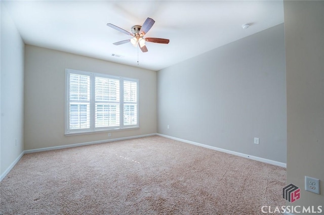 empty room featuring light carpet and ceiling fan