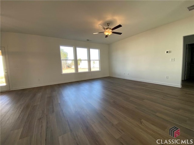 unfurnished room featuring ceiling fan and dark hardwood / wood-style floors