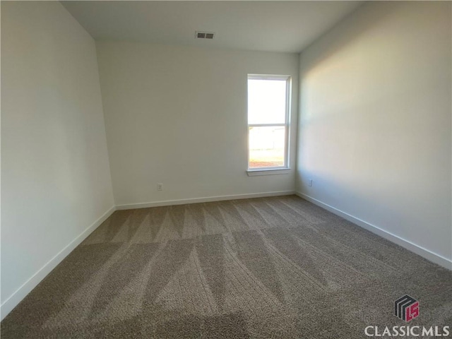 empty room featuring carpet flooring