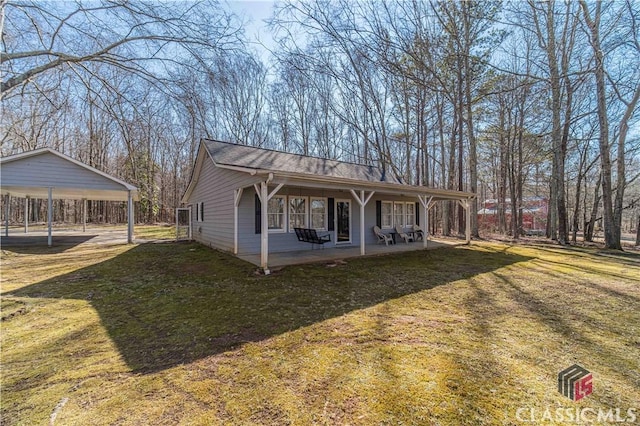 exterior space with a lawn and a patio