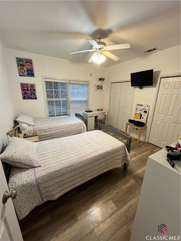 bedroom featuring ceiling fan and dark hardwood / wood-style flooring