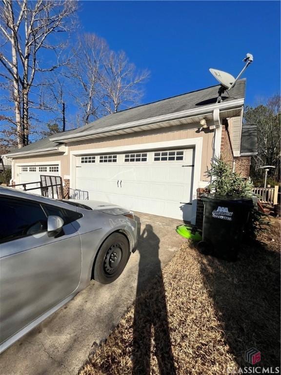 view of side of home with a garage