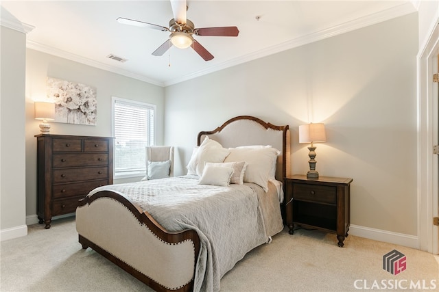 bedroom featuring ceiling fan, light carpet, and ornamental molding