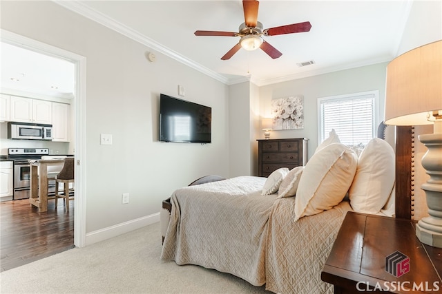 bedroom featuring ceiling fan, light colored carpet, and ornamental molding