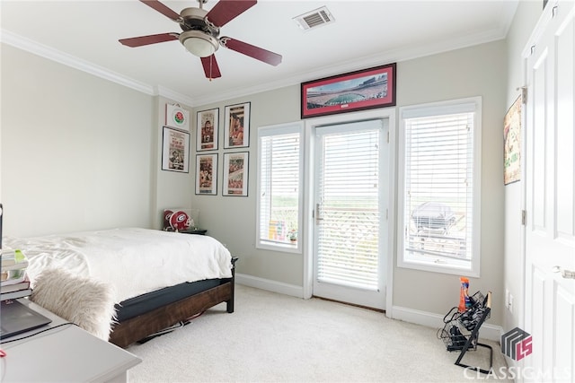 carpeted bedroom with ceiling fan, multiple windows, and ornamental molding