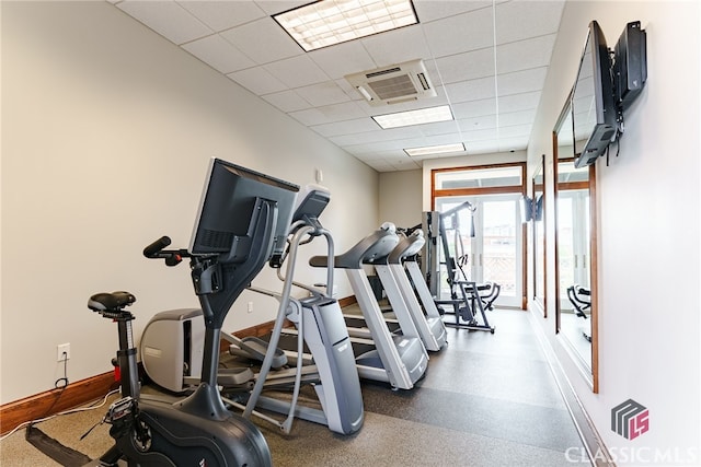 workout area with a drop ceiling