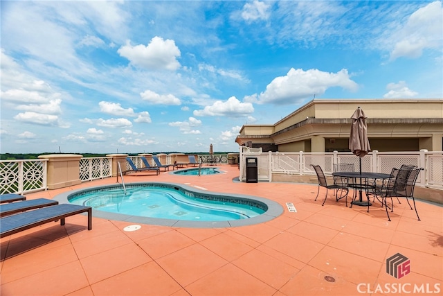 view of swimming pool featuring a patio