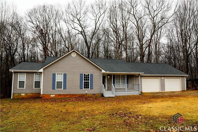 single story home with a garage and covered porch