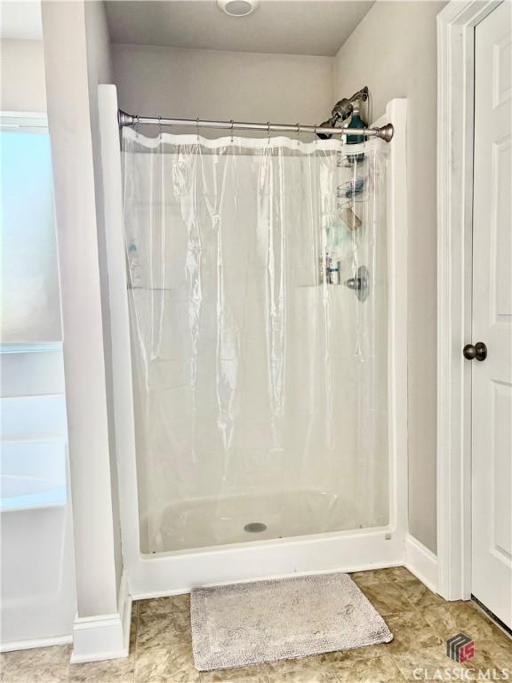 bathroom with curtained shower