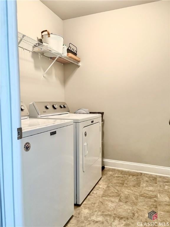 laundry room with independent washer and dryer