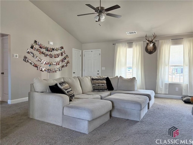 living room with ceiling fan, vaulted ceiling, and carpet flooring