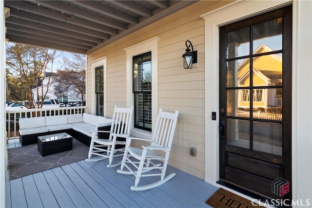 deck featuring an outdoor hangout area and covered porch