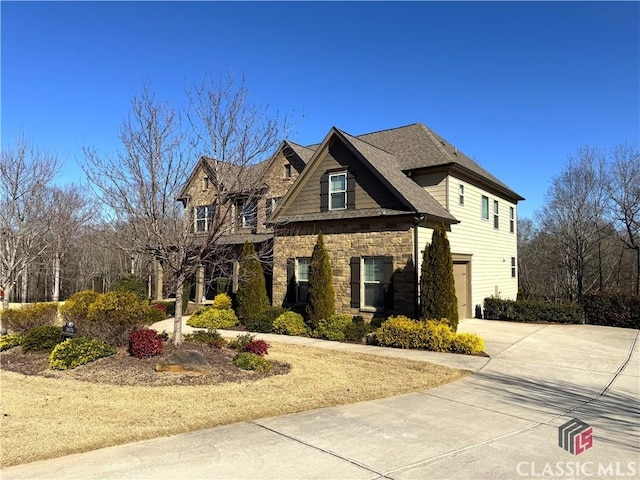 craftsman inspired home with a garage