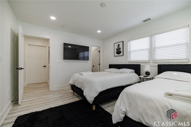 bedroom with light hardwood / wood-style flooring