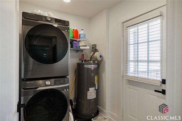 laundry area featuring stacked washing maching and dryer and water heater