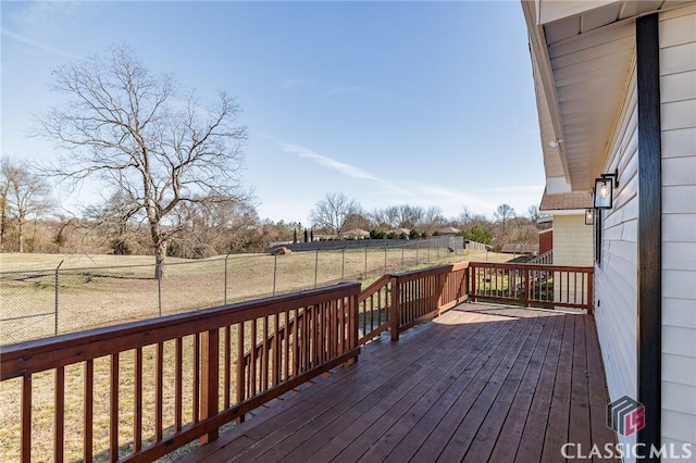 wooden deck featuring a rural view