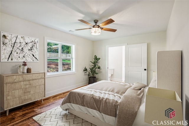 bedroom featuring ceiling fan and dark wood-type flooring