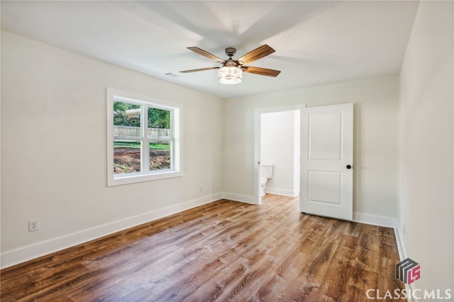 unfurnished bedroom featuring ceiling fan and wood-type flooring