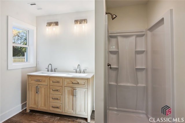 bathroom featuring vanity and wood-type flooring