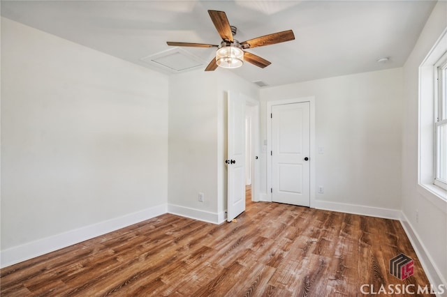 spare room featuring ceiling fan and wood-type flooring