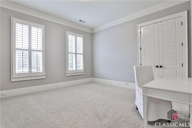 carpeted office space featuring ornamental molding