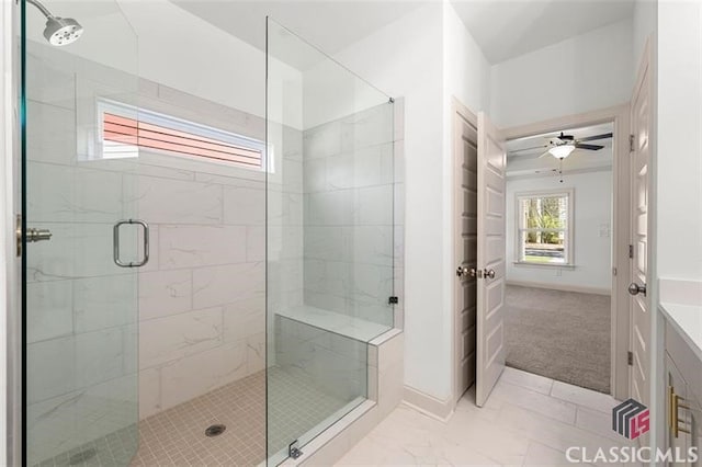 bathroom with ceiling fan and a shower with door