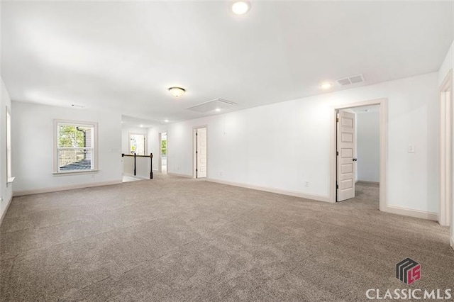 empty room featuring light colored carpet