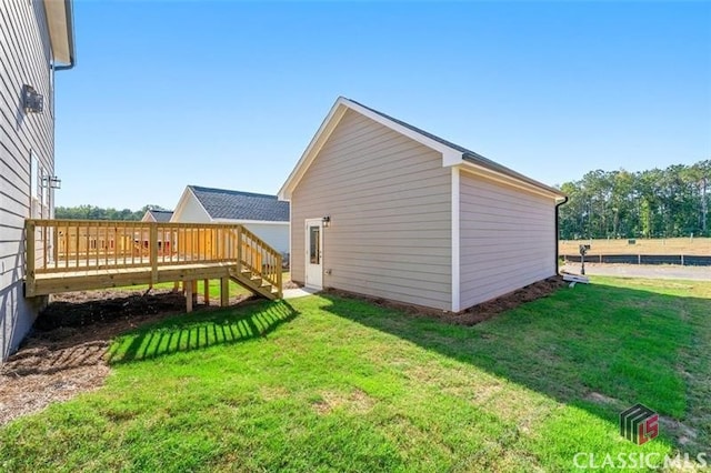 view of yard featuring a wooden deck