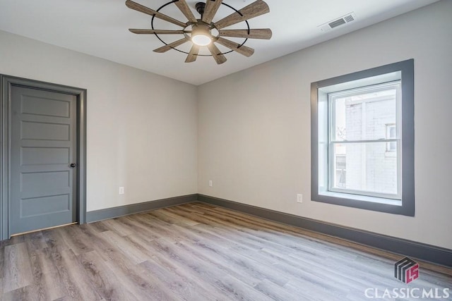 unfurnished bedroom featuring ceiling fan and light wood-type flooring