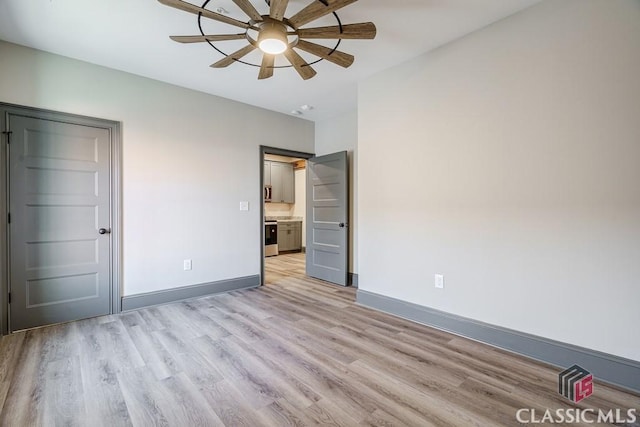 full bathroom with vanity, tiled shower / bath, wood-type flooring, and toilet