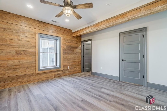 unfurnished bedroom featuring crown molding, ceiling fan, and light wood-type flooring