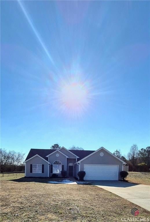 single story home with a garage