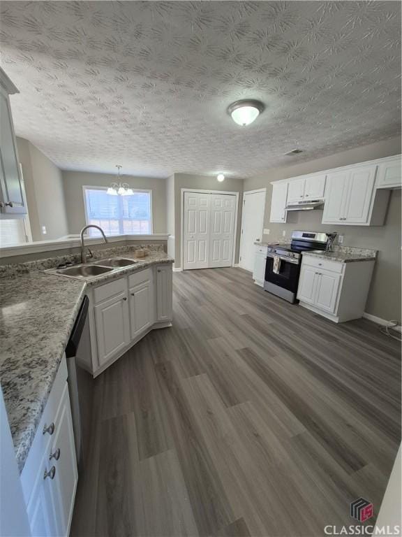 kitchen with appliances with stainless steel finishes, sink, white cabinets, dark hardwood / wood-style flooring, and a textured ceiling