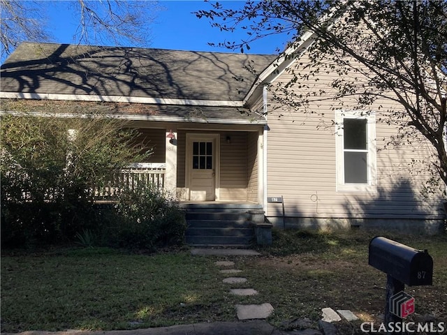 view of front of home with a front lawn and a porch