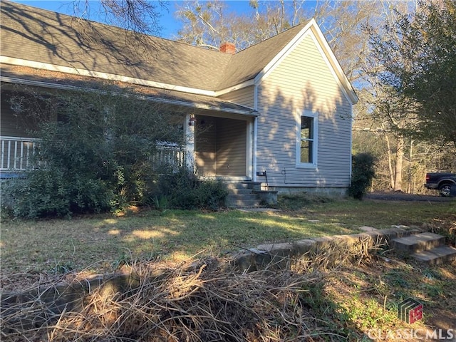 view of home's exterior featuring a lawn