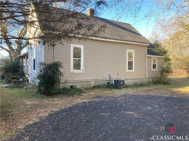 view of home's exterior with central air condition unit