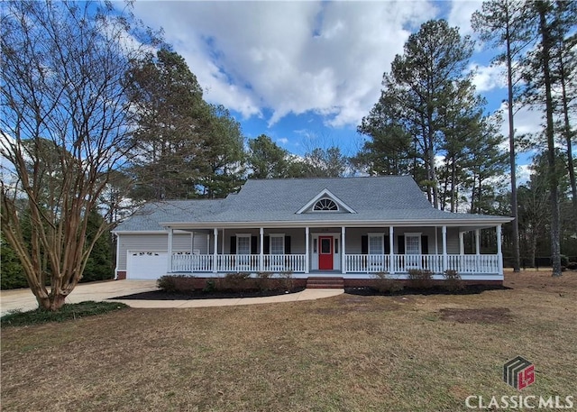 country-style home with a garage, a front yard, and a porch