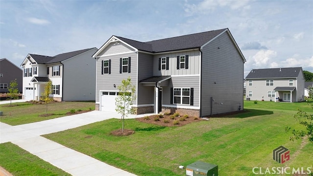 view of front facade with a garage and a front lawn