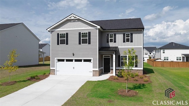 view of front of property with a garage and a front yard