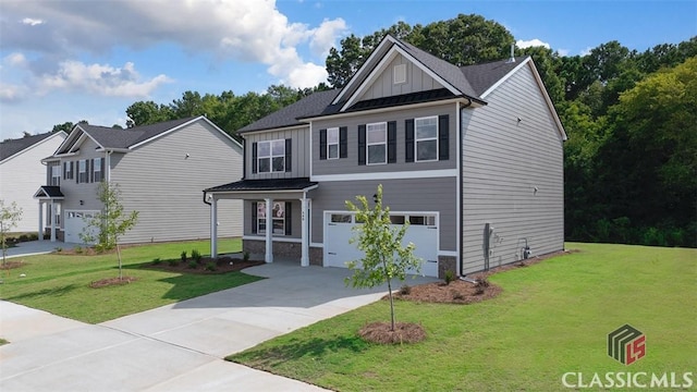 view of front of property featuring a garage and a front lawn