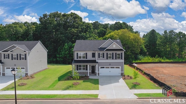 view of front of house with a garage and a front yard