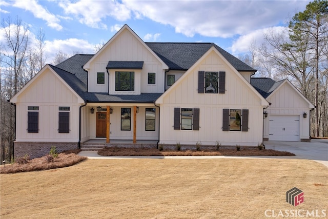 modern farmhouse style home featuring a garage and covered porch