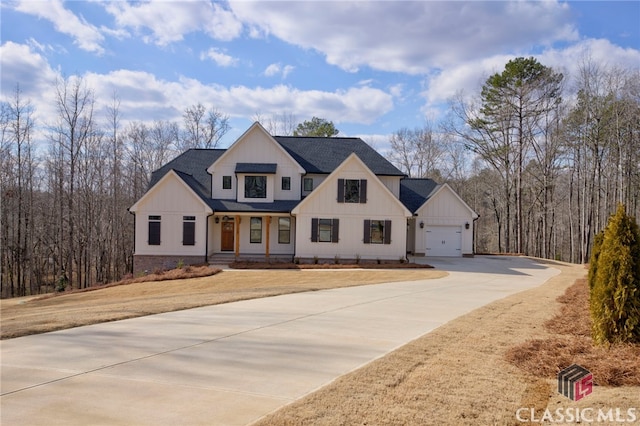 modern inspired farmhouse featuring a garage