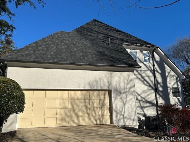 view of property exterior featuring a garage