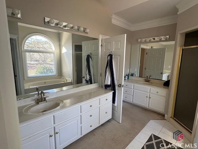 bathroom with vanity, tile patterned floors, and plus walk in shower