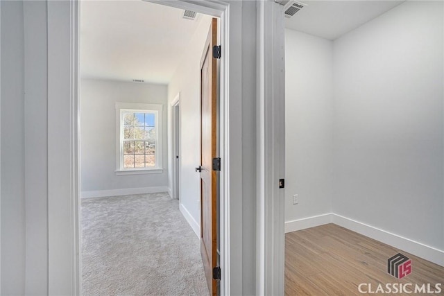 corridor featuring light hardwood / wood-style flooring