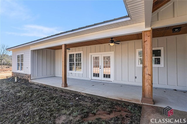 view of exterior entry featuring french doors, ceiling fan, and a patio area